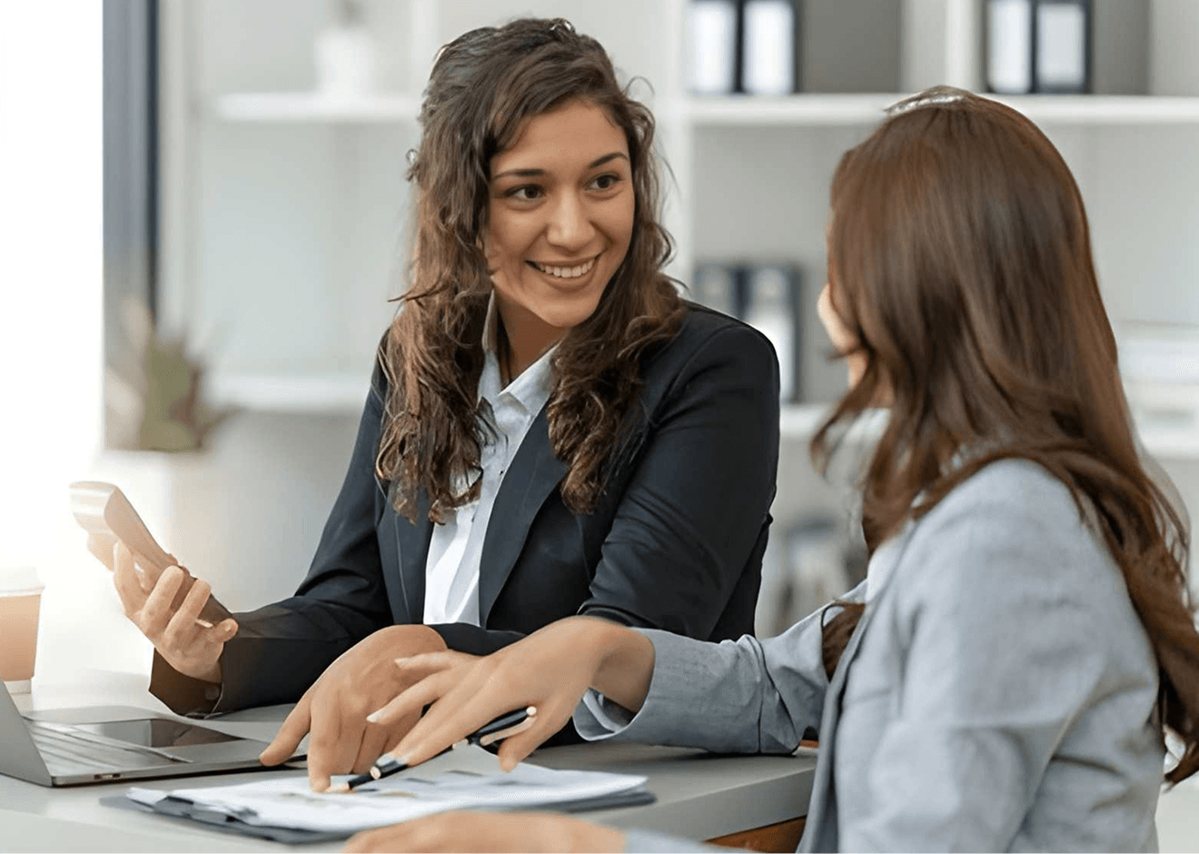 Two professionals in a modern office setting